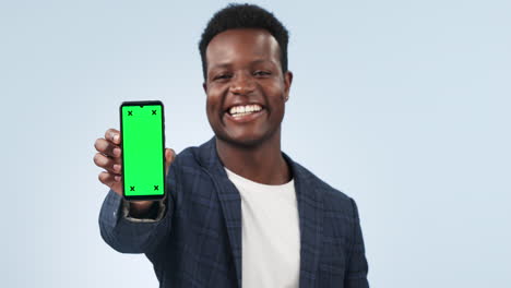 happy black man, phone and pointing to green