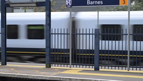 south west trains driving past barnes station, london, united kingdom