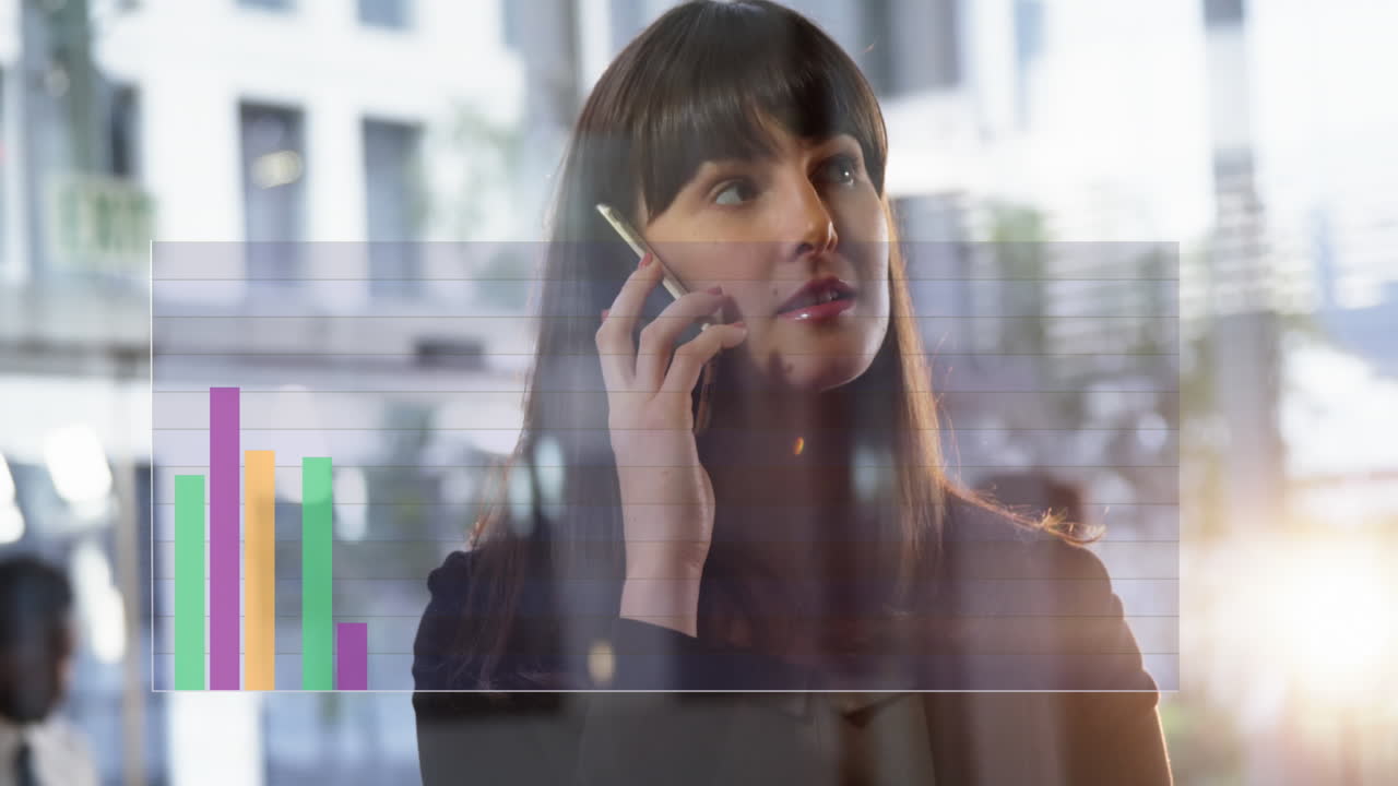 Animation of financial data processing over caucasian businesswoman talking on smartphone