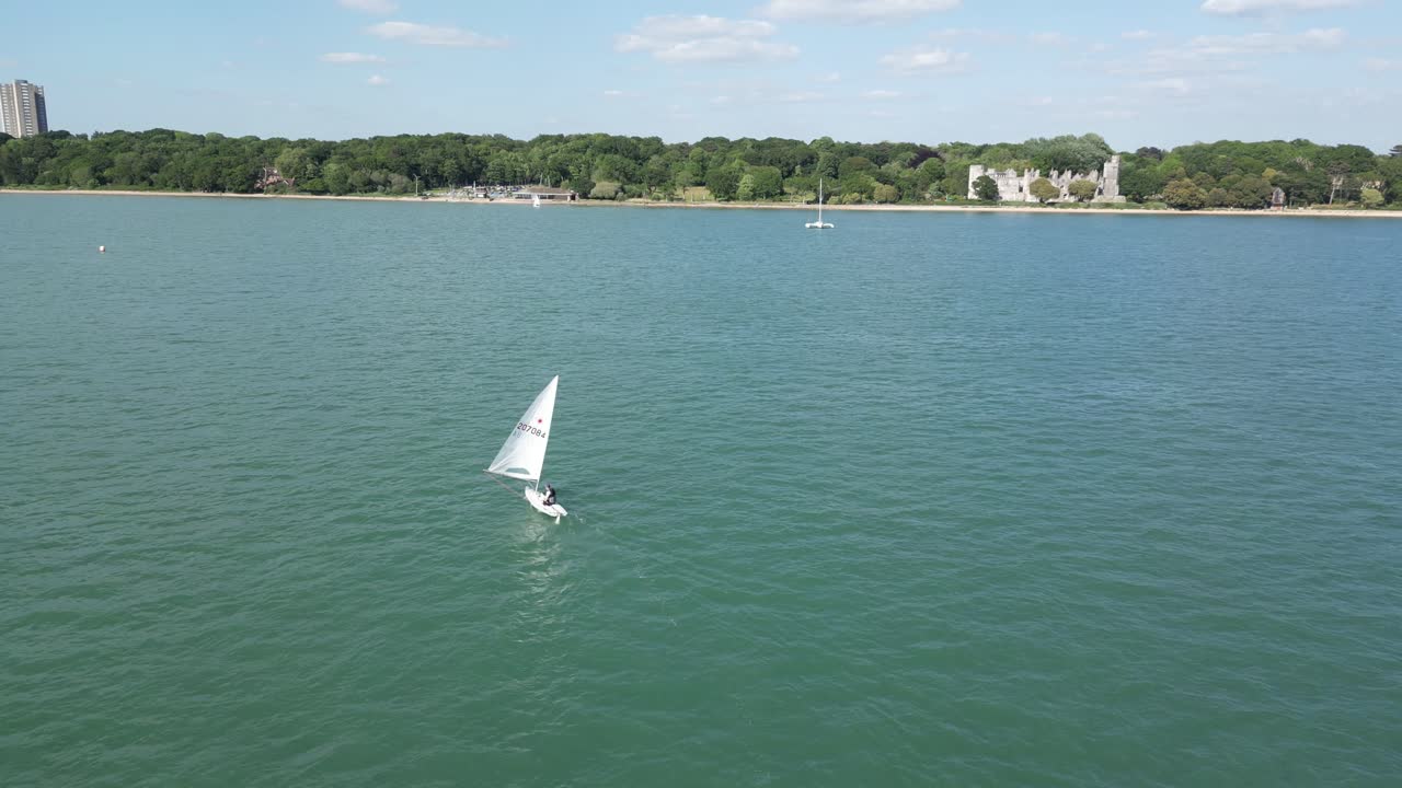 Aerial drone footage showcases the historic Netley Abbey in Hampshire, revealing its ancient ruins amidst lush surroundings and providing a unique perspective of this significant landmark.