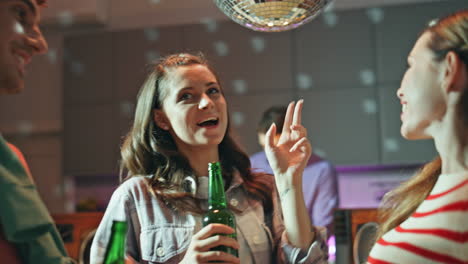 laughing colleagues dancing disco party in apartment close up. excited people