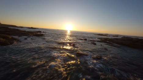 fpv drone flying along the atlantic coast of galicia at golden hour with waves and seagulls