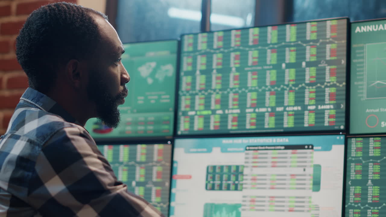 Financial analyst monitoring forex exchange numbers in office