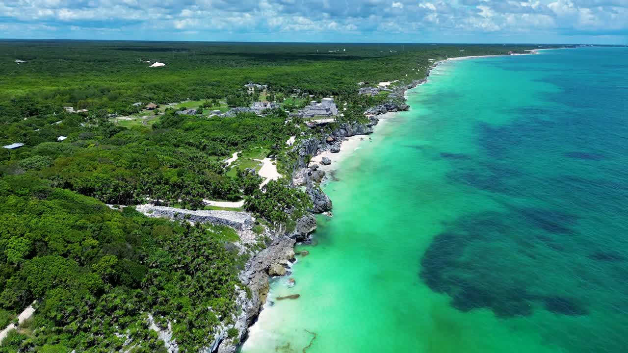 Drone aerial landscape of Tulum historic ruins on headland coastline ocean sandy beach rainforest landmark of Quintana Roo Mexico Central America travel tourism