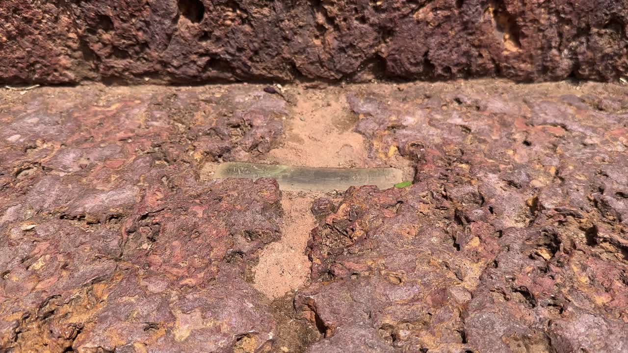 Old stone staircase with metal braces, tracking left to right shot of a stairs made of stone in ancient time with the metal link to bind them