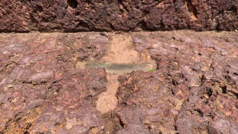 old stone staircase with metal braces, tracking left to right shot of a stairs made of stone in ancient time with the metal link to bind them
