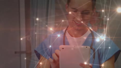 Animation-of-network-of-connections-over-caucasian-male-doctor-using-tablet