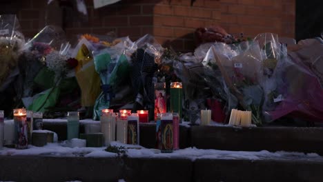 Michigan-State-University-Mass-shooting-memorial-at-The-Spartan-Statue-close-up-of-flowers-and-candles