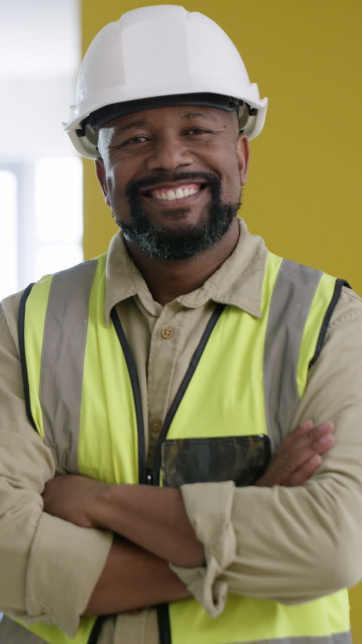 Smiling Construction Worker in Hard Hat and Safety Vest