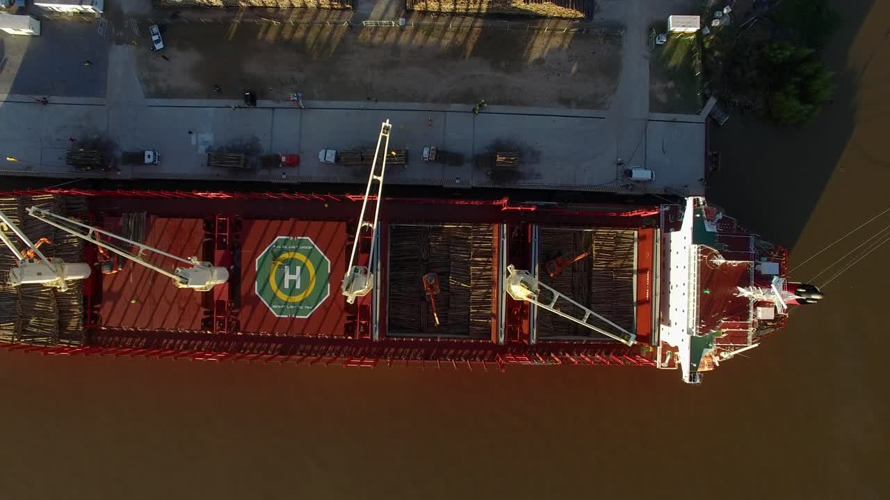 Top View Of Cargo Ship With Helipad And Cranes Loading Woods At The Port Of Buenos Aires In Argentina