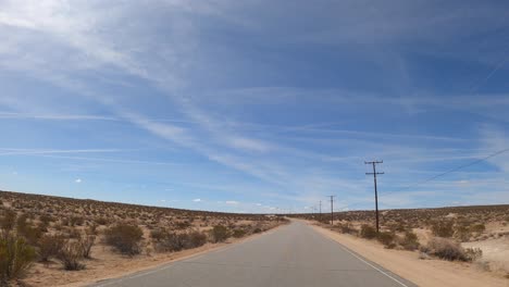 Driving-through-the-Mojave-Desert-on-a-hot-and-sunny-day---driver-point-of-view