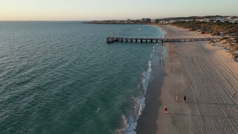 Pier-on-Coogee-Beach-at-sunset,-Perth-City-in-Western-Australia