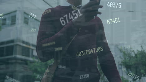 animation of graphs and changing numbers, senior african american man with bicycle using smartphone