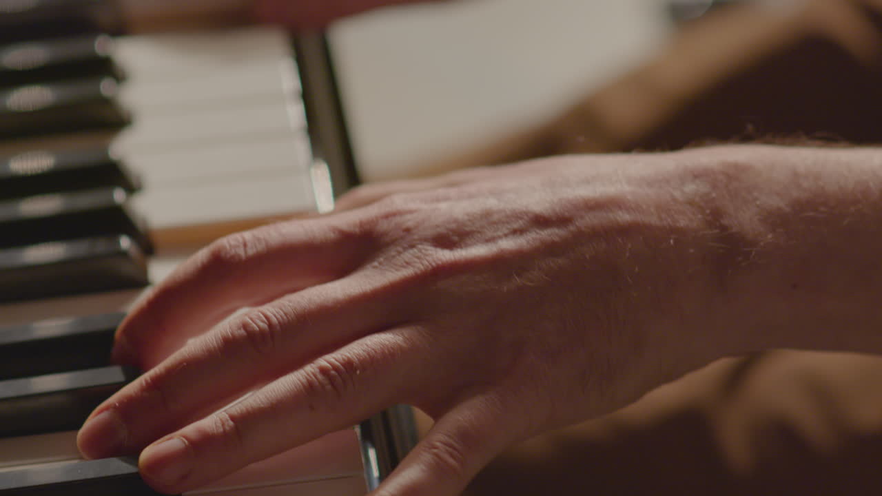 Hands of Pianist Playing Piano