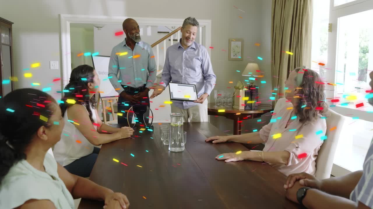 Host handing award as family clapping, recipient rising and accepting award, confetti at table