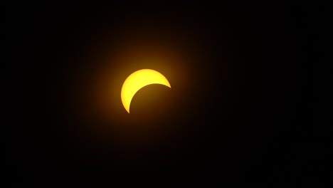The moon partially blocking the sun during a solar eclipse