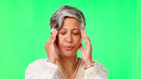 headache, stress or mature woman on green screen