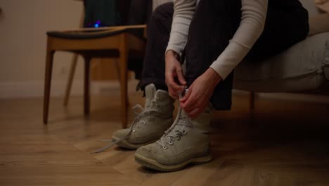 Woman Putting On Winter Boots
