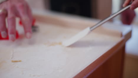 dad helps son bake holiday cookies