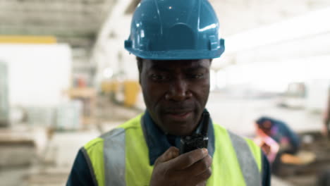 man talking on walkie talkie