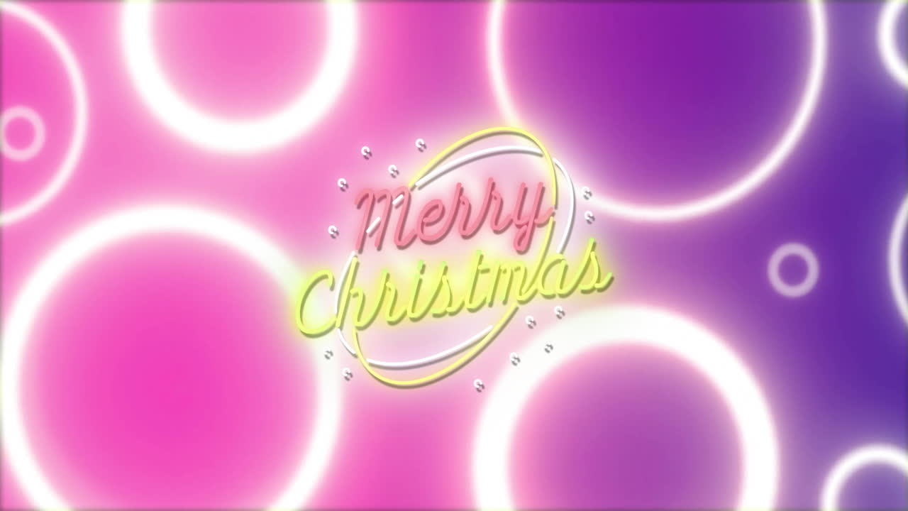 Merry Christmas text animation over glowing circles on pink and purple background