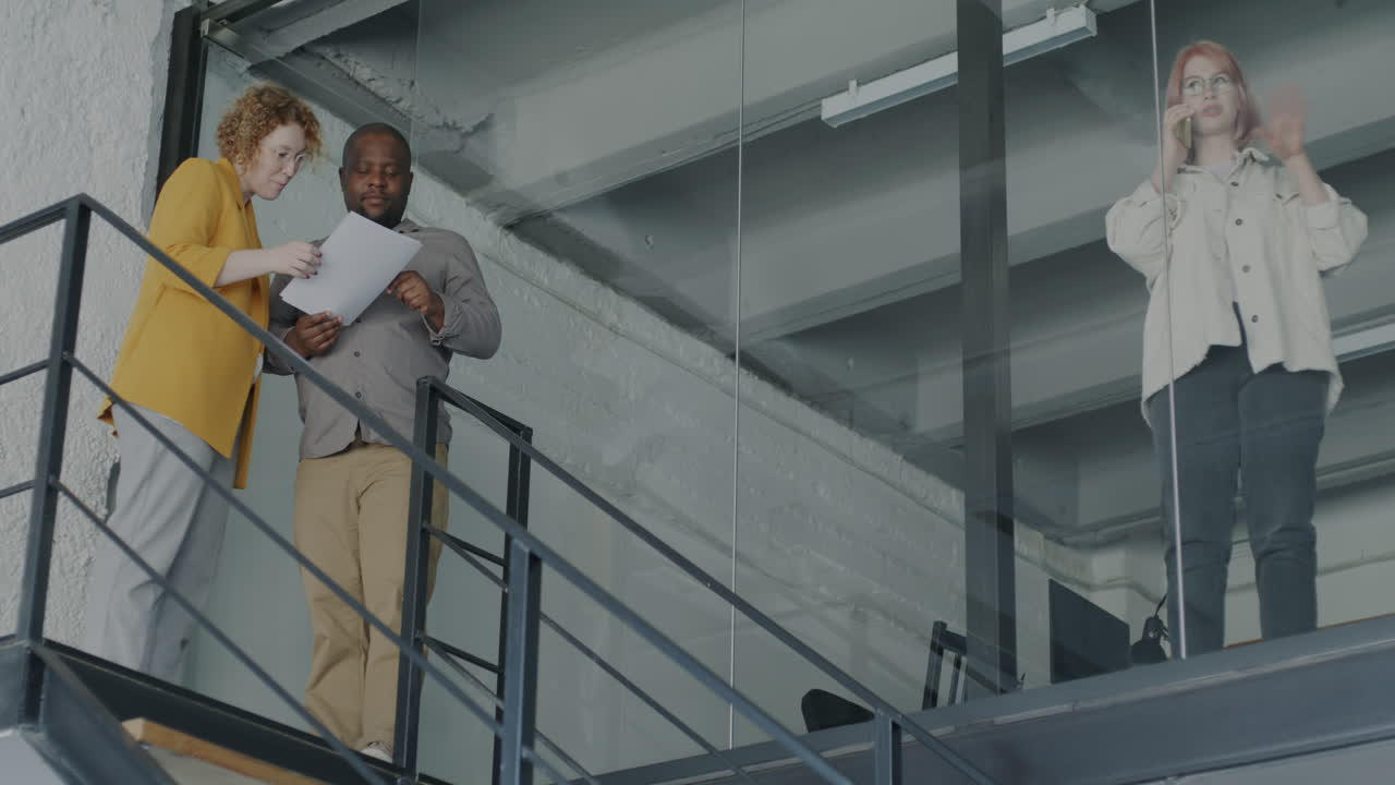 Business meeting on office staircase