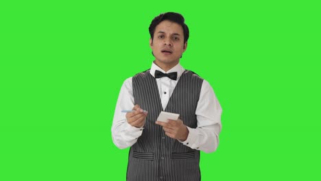 Frustrated-Indian-waiter-writing-order-Green-screen