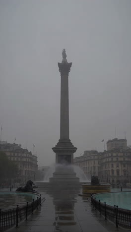 trafalgar square in london on a misty day