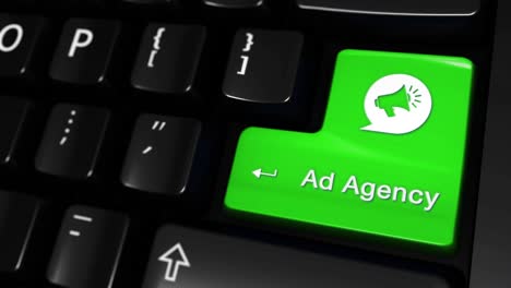 green button with 'ad agency' label on computer keyboard