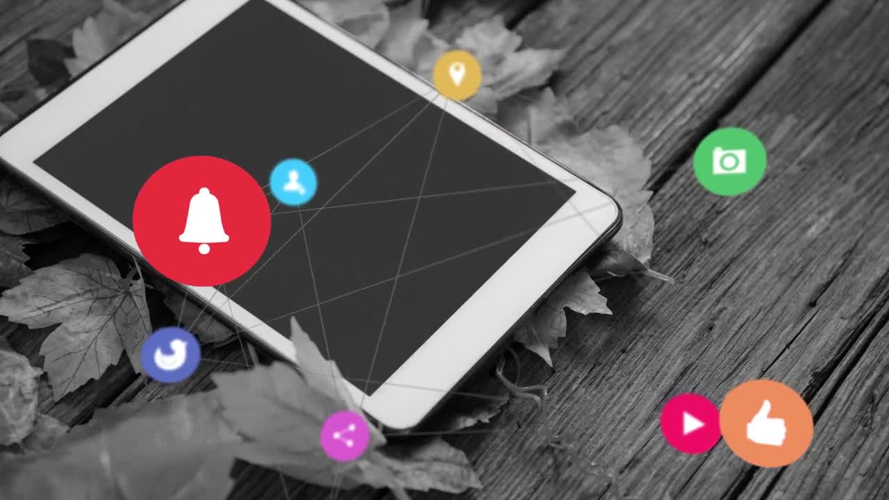 Animation of media icons over tablet and leaves