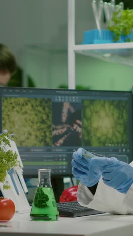 female scientist conducts biotechnology and plant research in laboratory