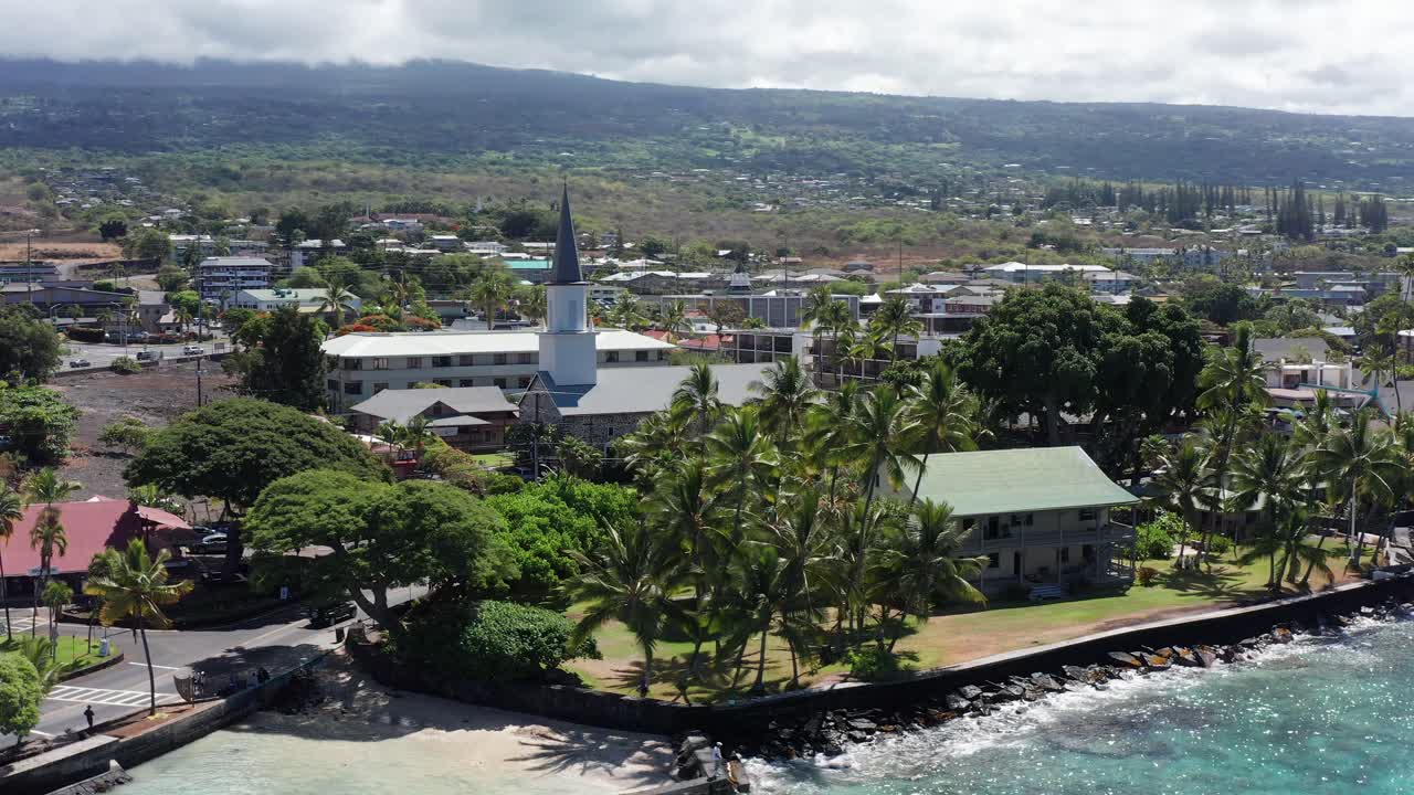 Wide panning aerial shot of the Hulihe'e Palace, the royal Hawaiian vacation home in Kailua-Kona, Hawai'i