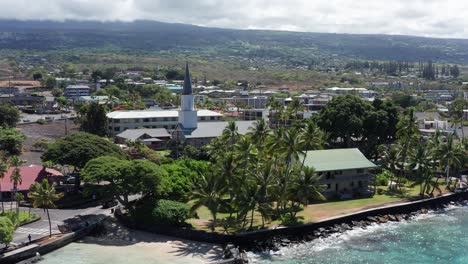 wide panning aerial shot of the hulihe'e palace, the royal hawaiian vacation home in kailua-kona, hawai'i