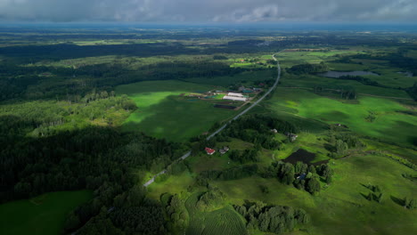 Aerial-view-of-rural-Latvia,-with-drifting-cloud-shadows