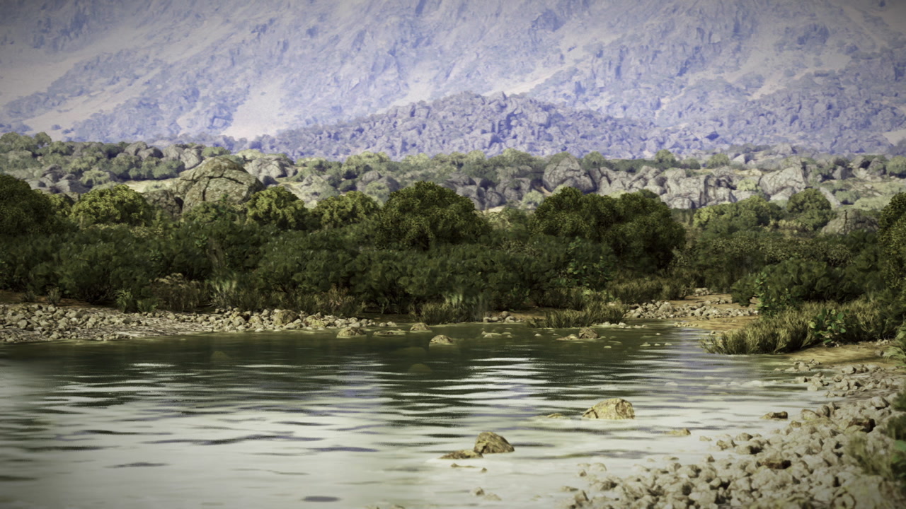 Tranquil shoreline next to distant mountains with vegetation and wildlife