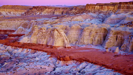 a slow, cinematic drone shot captures the colorful landscape and towering hoodoos near the utah-arizona border.