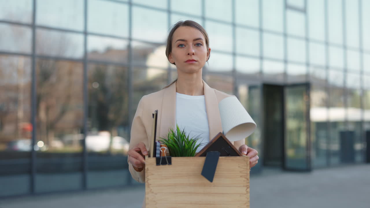 Disappointed Businesswoman Holding Personal Items After Job Loss