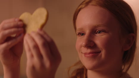 heart shaped cookie being held