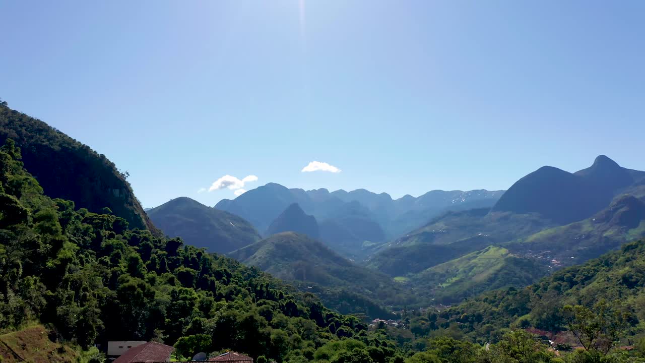 Aerial over small houses outside mountain town of Petrópolis, Rio de Janeiro.