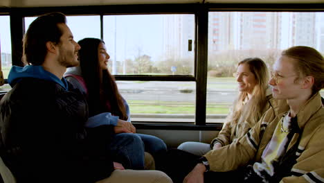 young people sitting in the bus