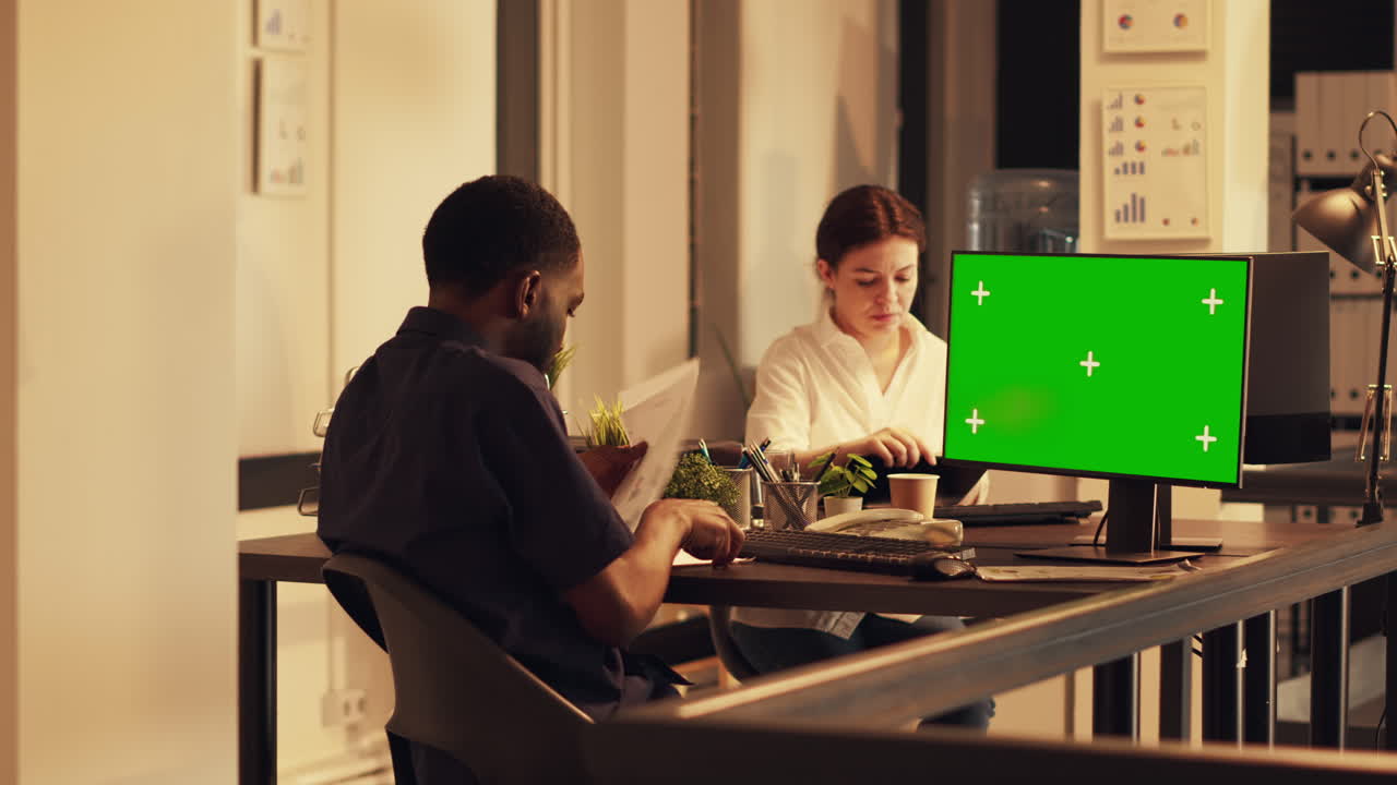 African american man working with greenscreen on computer
