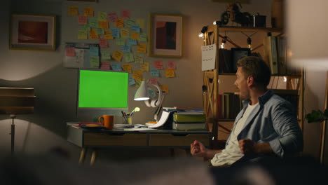 Excited-man-yes-gesturing-home-closeup.-Overjoyed-guy-typing-mockup-computer