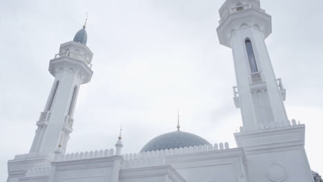 white mosque minarets and dome