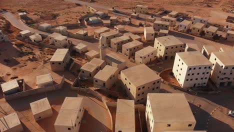 aerial shot of an old empty city in the desert in palestine near gaza at morning