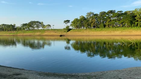 establisher pan shot of surma river in sylhet bangladesh, peaceful scenery