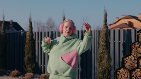 woman dancing outdoors in winter