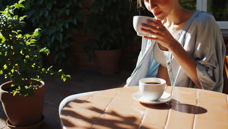 woman enjoying coffee outdoors