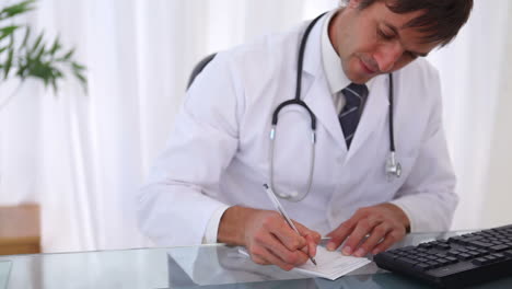 Doctor-writing-a-prescription