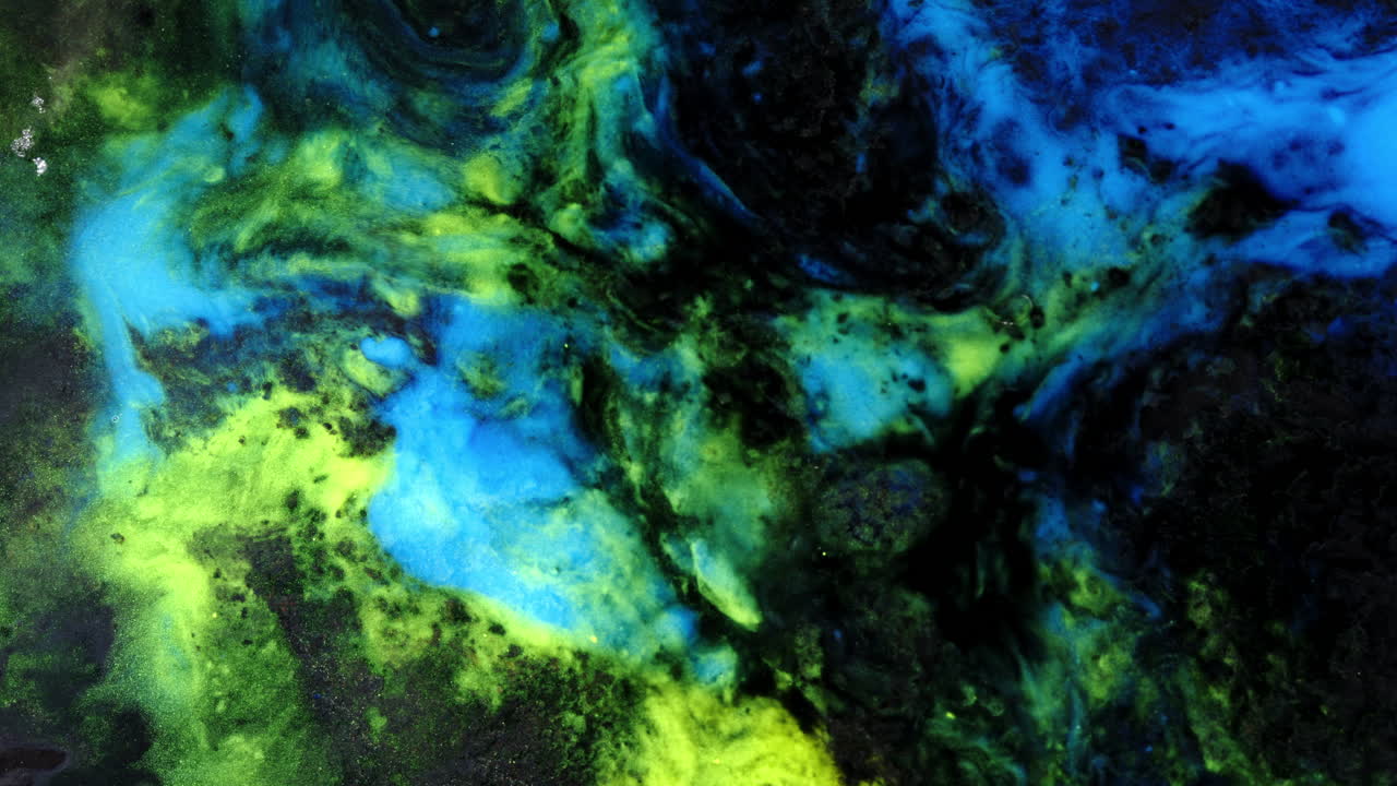 Colorful abstract macro of vibrant substances mixing in fluid motion and texture