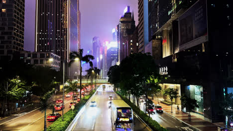 night traffic driving on gloucester road in wan chai, hong kong